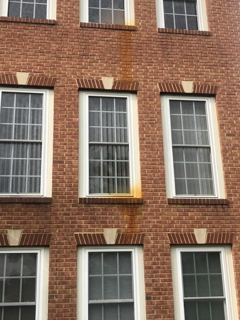 Rust on brick and window frames